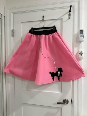 Charades light bright pink felt poodle skirt (size adult small, fair condition)